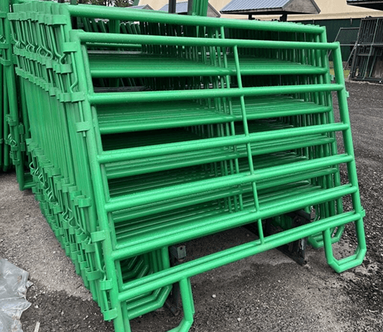 Green fence panels stacked at Cashman's