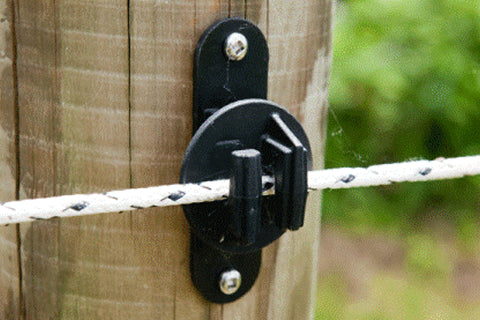 Close-up of Cashman Elite fencing hardware and rope on a wood post
