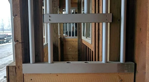 Wooden structure with metal bars and a horizontal metal plate