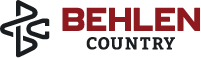 The logo for Behlen Country, featuring a stylized black and red 'BC' monogram on the left and the words 'BEHLEN COUNTRY' in black and red on the right, set against a solid black background.