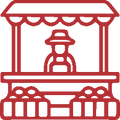 A red line icon depicting a market stall with a vendor wearing a hat, on a white background.