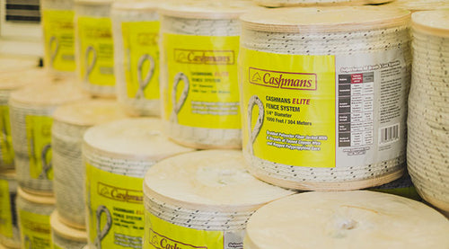 Multiple spools of Caspian's fence system with visible labels.
