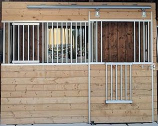 aluminum horse stall front with a drop down socializing door and swing out feed door