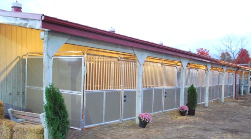 aluminum modular horse stalls in a row at a fairgrounds